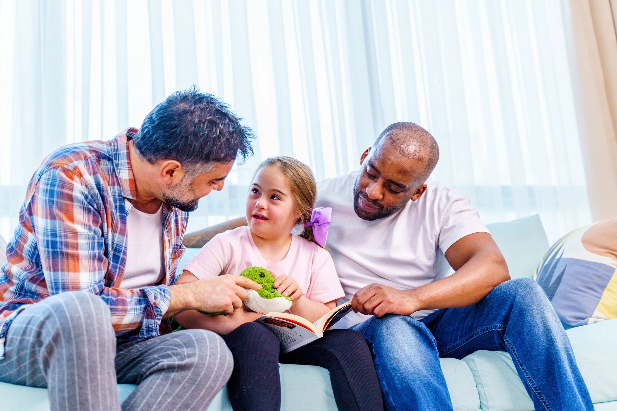 Parents and child reading together