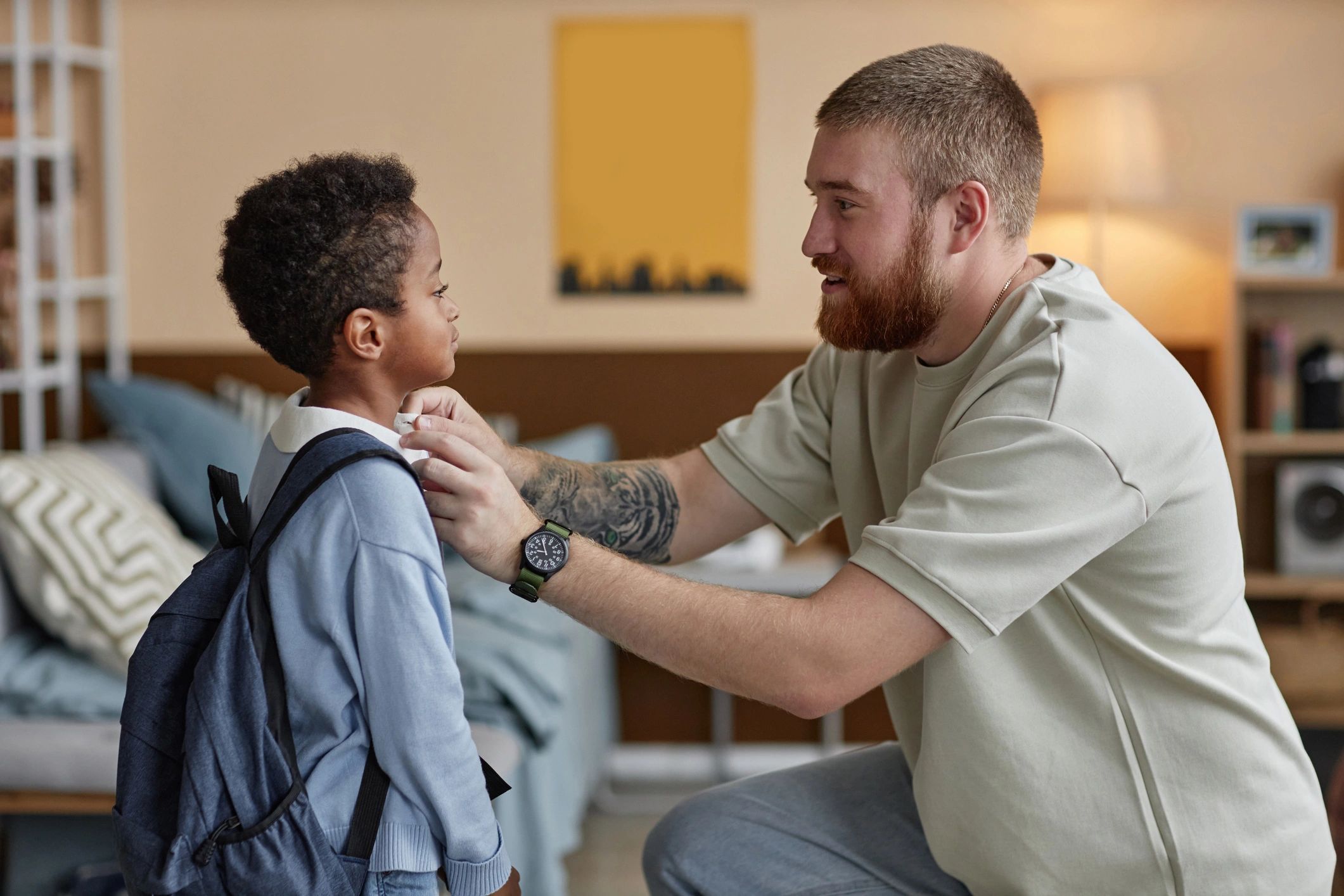 Parent helping child get ready for the day