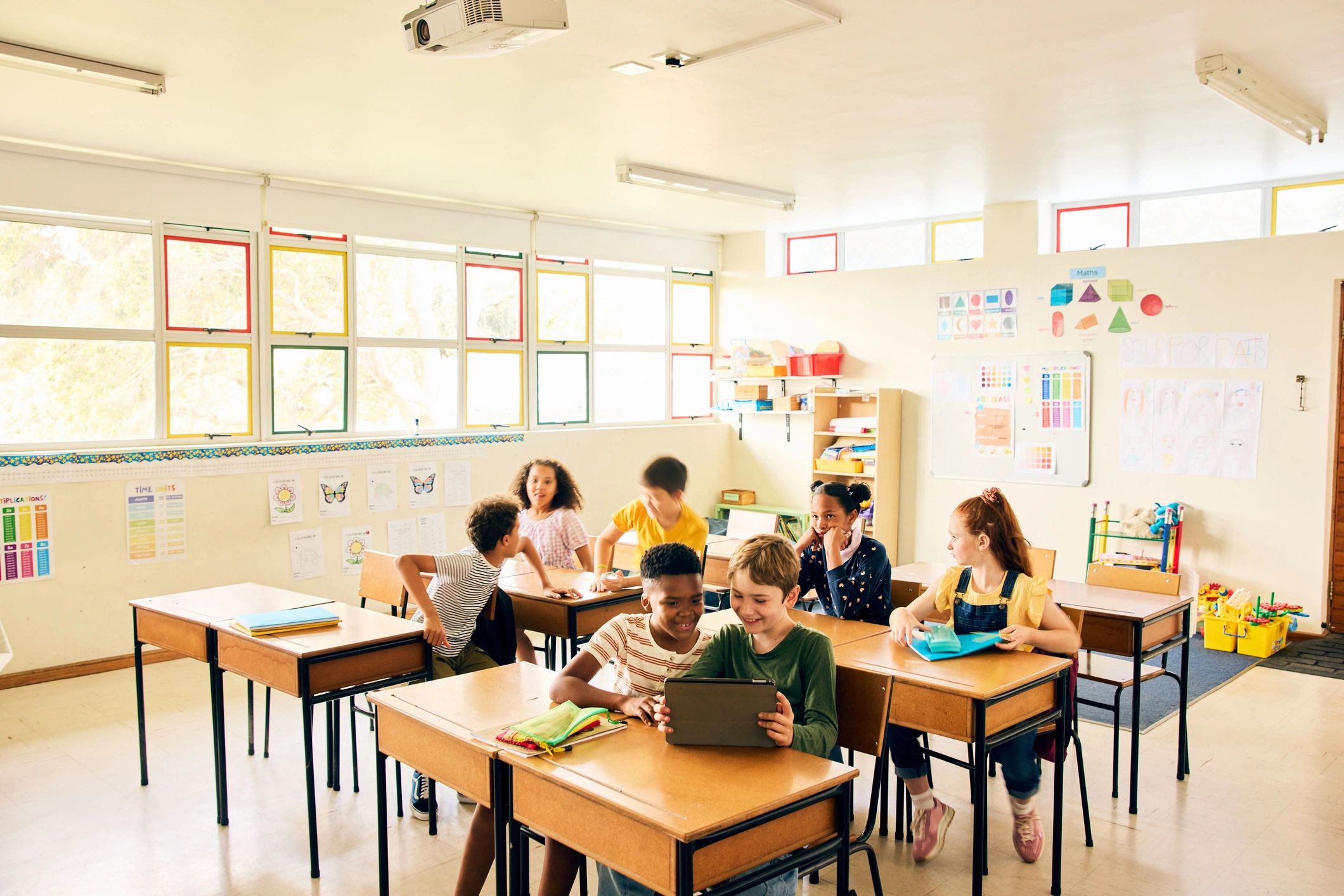 Children learning and playing together in a colorful classroom