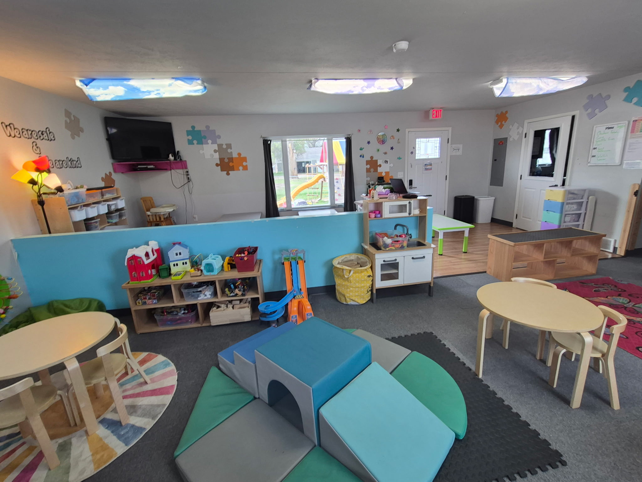 Children and teacher in a Cozy Corner Daycare classroom